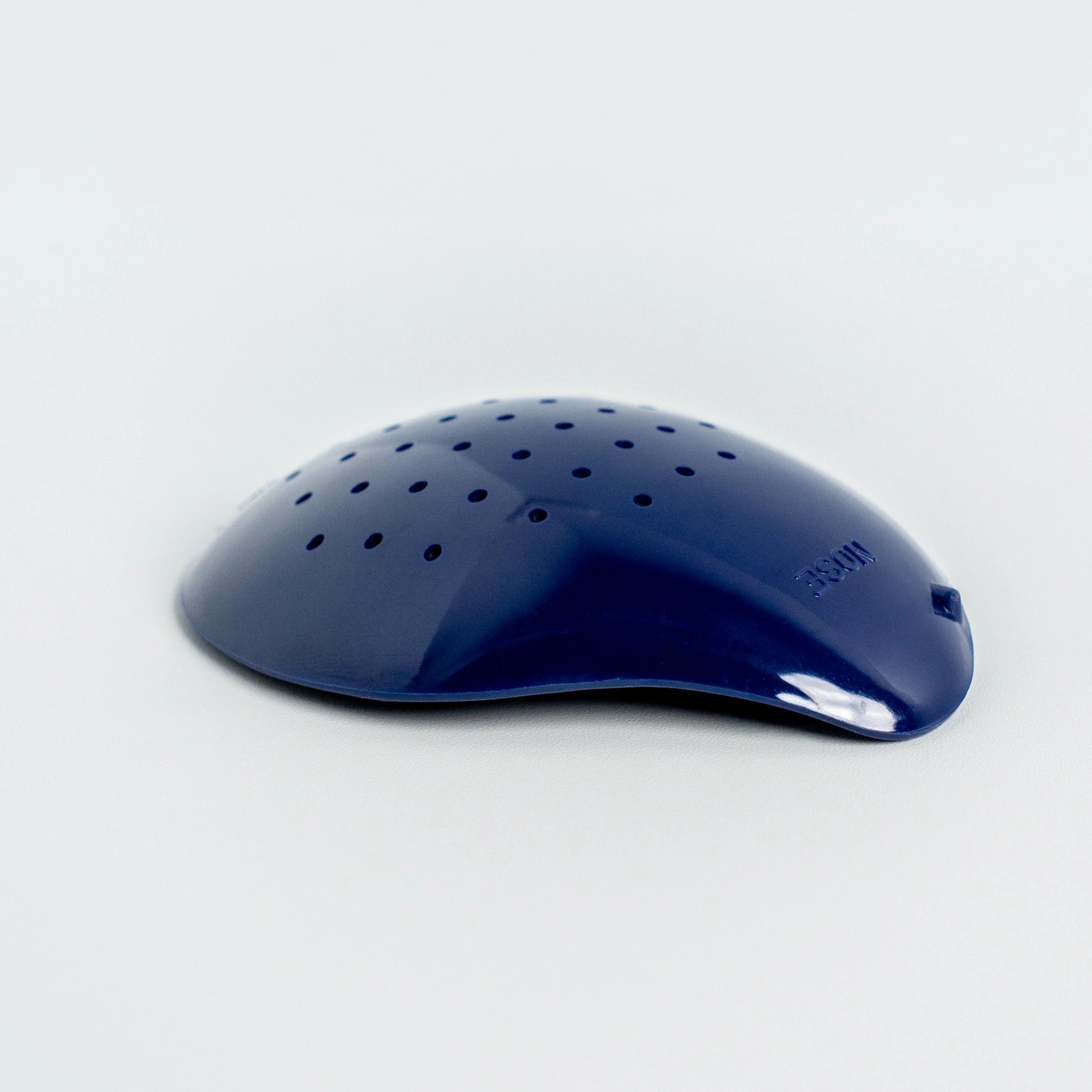 Side view of blue polycarbonate deep shell eye shield for right eye showing curved design